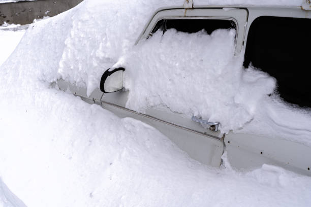 istock Car stuck in a snow trap after a winter blizzard 1450229645