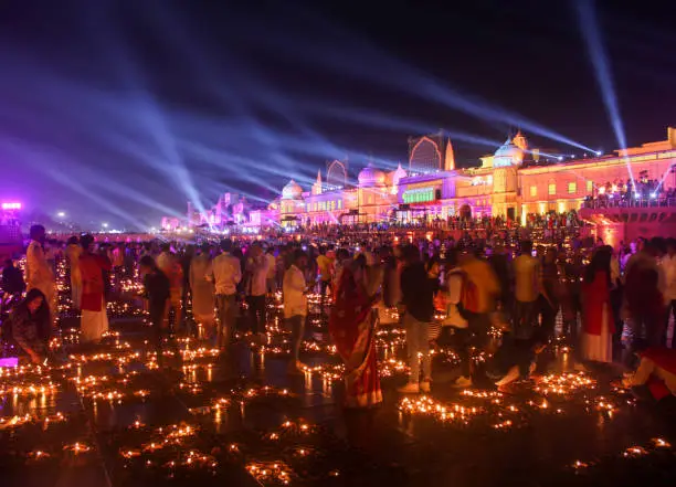 Beautiful landscape view of lights and lamps in Ayodhya, Hindu devotees are celebrating Deepawali and Deepotsav in Ram Mandir in Ayodhya near the river bank of Saryu, Ram ki paidi, Uttar Pradesh, India.