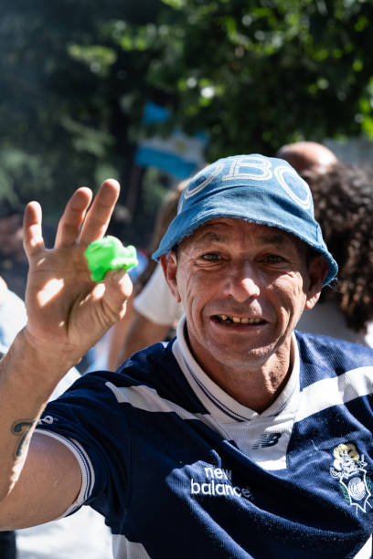 An argentine and gimnasia y esgrima de La Plata fan  celebrates that Argentina won 2022 FIFA World Cup in Qatar La Plata, Buenos Aires, Argentina - December 18, 2022: An argentine and gimnasia y esgrima de La Plata fan  celebrates that Argentina won 2022 FIFA World Cup in Qatar gimnasia stock pictures, royalty-free photos & images