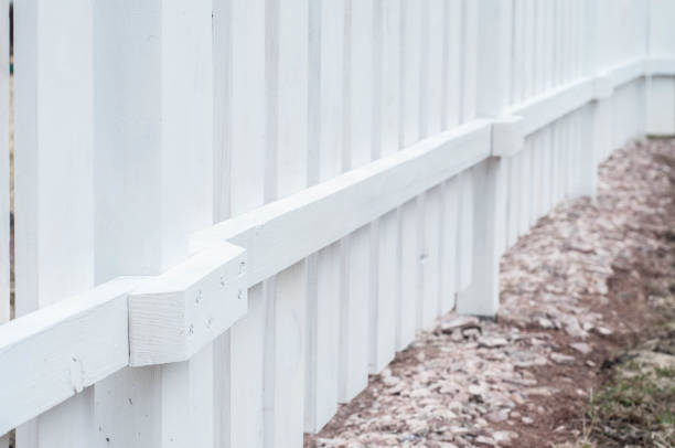 The idea of mounting and installing a fence to protect the beds from the garden on a private plot in nature