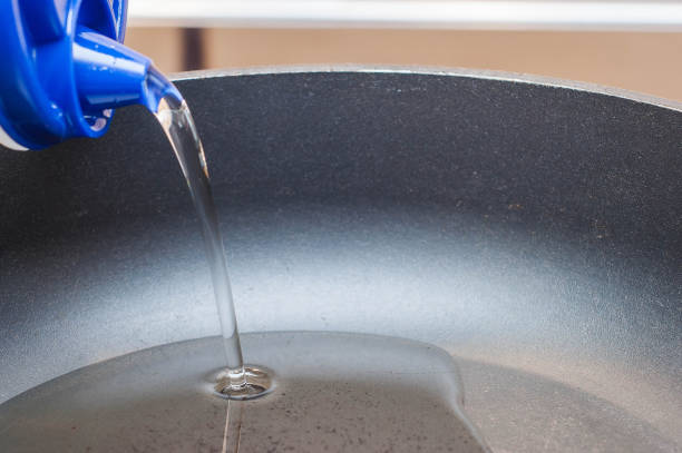 istock Sunflower oil in a black frying pan to avoid burning when cooking 1450232438