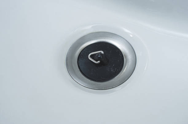istock Sewer drain hole is closed with a special rubber plug in the bathroom. 1450234709