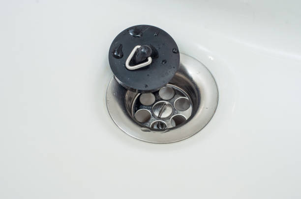istock Sewer drain hole is closed with a special rubber valve in the bathroom. 1450234726