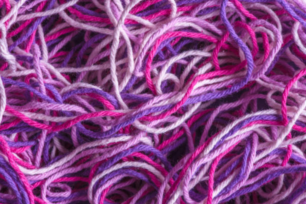 istock Close-up colorful wool for knitting and weaving, multi colored tangled yarn 1450237380