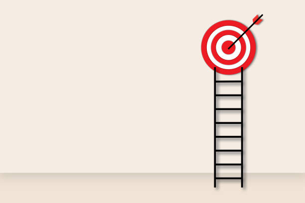istock Ladder to the red target on pastel wall background as metaphor for business target or goal success and winner. 1450244741