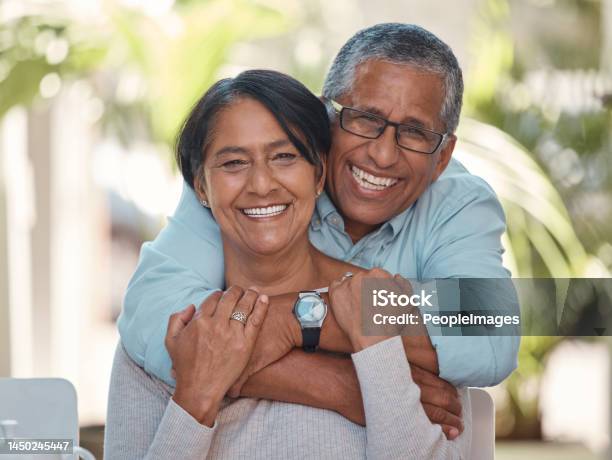 Portrait Elderly And Couple Bonding On A Patio At Home Hug Laugh And Relax Outdoors Together Love Retirement And Happy Seniors Enjoying Their Relationship And Bond Free Time And Fresh Air Stock Photo - Download Image Now