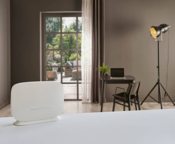istock Close up white modem on the table and decorative living room background style. 1450245851
