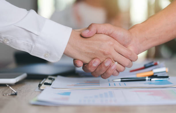 istock business people shaking hands indicating agreement business,concept progress in development, financial efficiency and investment with business strategy for goals and opportunities in industry future 1450248116
