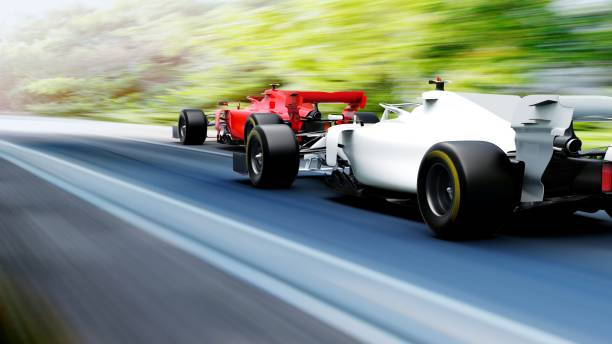 istock red race car leading on a race track 1450248164