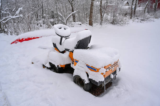 riding lawnmower standing outside covered in snow Kumla Sweden december 16 2022
