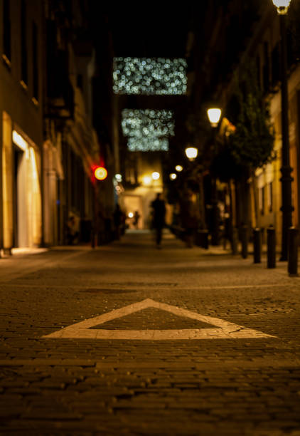 istock White triangle sign on street at night. Madrid, Spain 1450249598