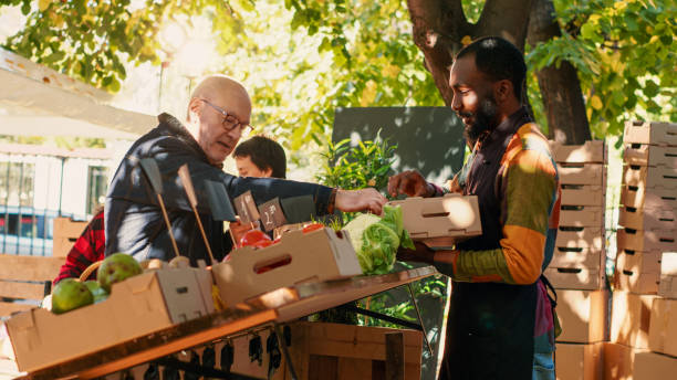 istock Diverse client and farmer choosing products to put in box 1450255584