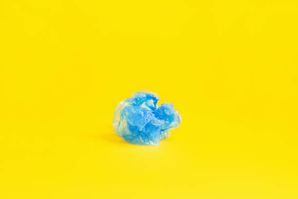 blue shoe covers on yellow background
