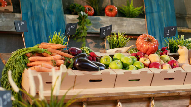 istock Colorful multiple fresh fruits and vegetables on counter 1450257957