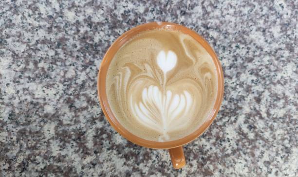 istock Hot latte coffee on marble table. Top view. 1450259705