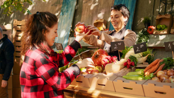 istock Vegetarian client choosing colorful apples and products 1450260796