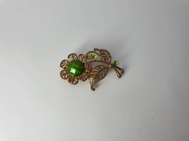istock A flower-shaped brooch Isolated 1450260943