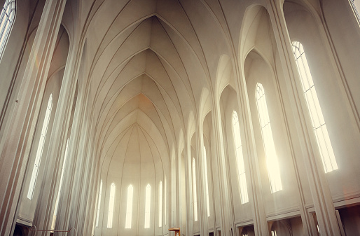 Famous Hallgrimskirkja church building interior photo. Beautiful urban architectural photography with arch ceiling on background. High quality picture for wallpaper, travel blog, magazine, article
