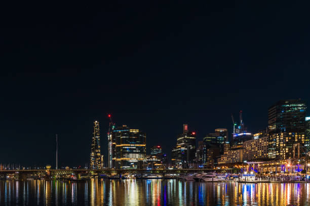 Sydney, Australia - April 16, 2022: Darling Harbour viewed towards King Street Wharf and Crown Sydney hotel at night time