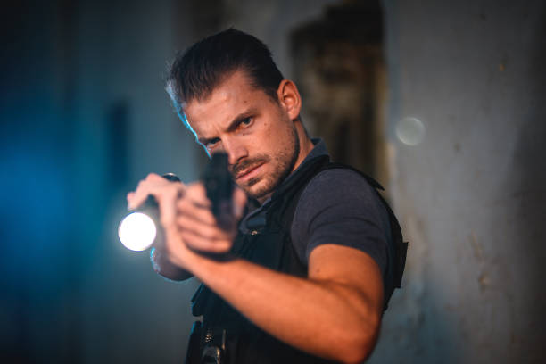 istock Good Looking Policeman Investigating A Crime Scene 1450262821