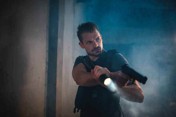 istock Caucasian Policeman Chasing A Criminal, Wearing A Bulletproof Vest 1450262851