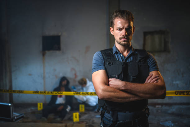 istock Attractive Forensic Male Detective Working On A Murder Scene 1450263452