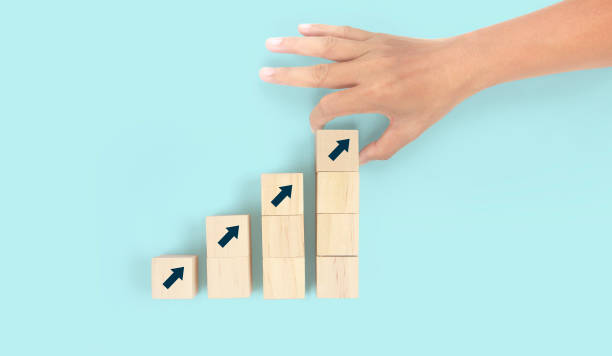 istock Business connecting piece of multi wood chart blocks steps in hand 1450263884