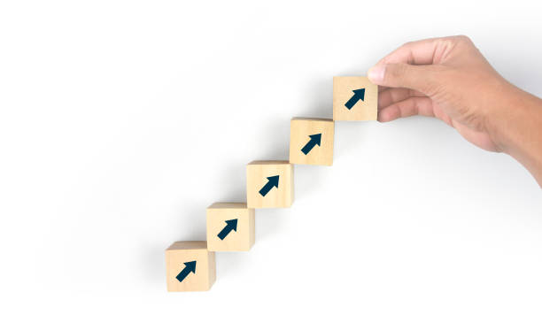 istock Business connecting piece of multi wood chart blocks steps in hand 1450263887