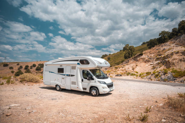 istock Camper Car Parked Next To The Road At Seaside 1450264051