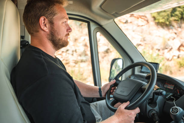istock Caucasian Male Driving A Camper Van 1450264069