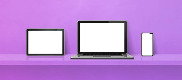 istock Laptop, mobile phone and digital tablet pc on purple wall shelf. Banner background 1450266301