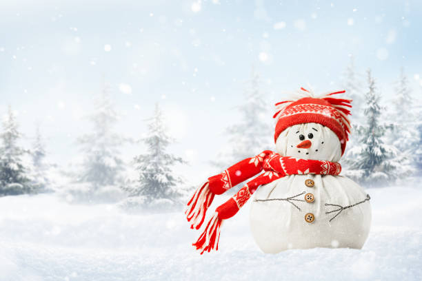 istock snowman on the background of winter forest 1450267716