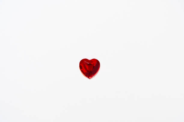 istock Love in valentine's day concept. Isolated heart shaped red ruby over white background 1450268163