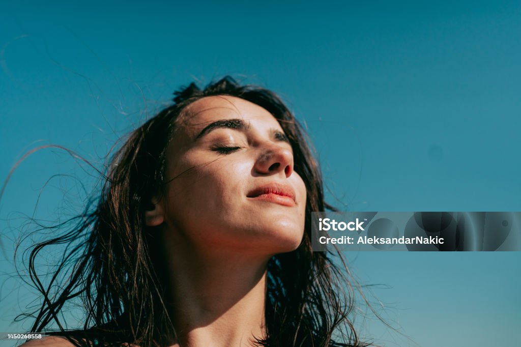 Summer selfie Self-portrait photo of a young woman at the beach. Women Stock Photo