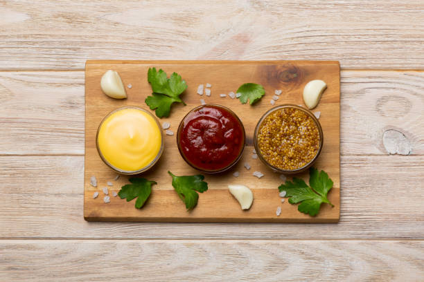 istock Many different sauces and herbs on table, flat lay top view. sauces on plate, healthy concept 1450270379