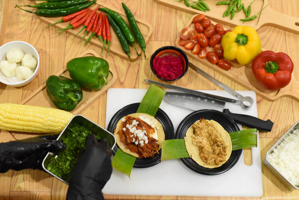 Green onion in hand for preparing Tacos in a mexican restaurant