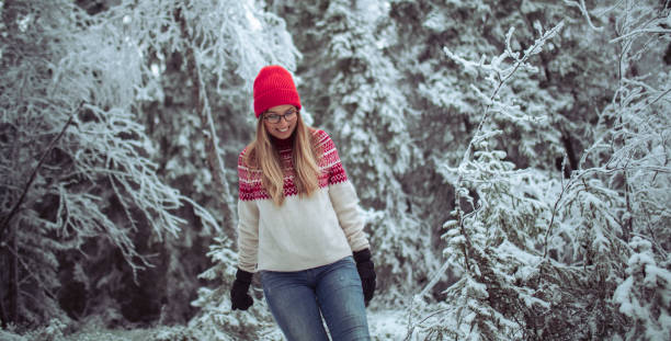 istock A smiling woman spends the day in a coniferous forest 1450274742
