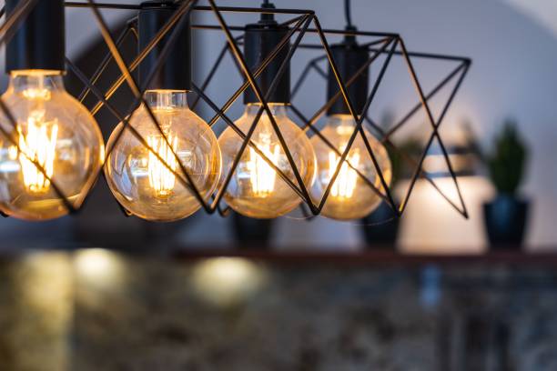 istock Closeup of glowing yellow light bulbs in blurred background 1450274782