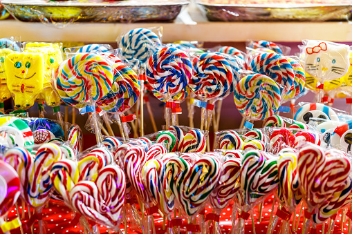 Photo of Colorful Candies in a Supermarket Stand.