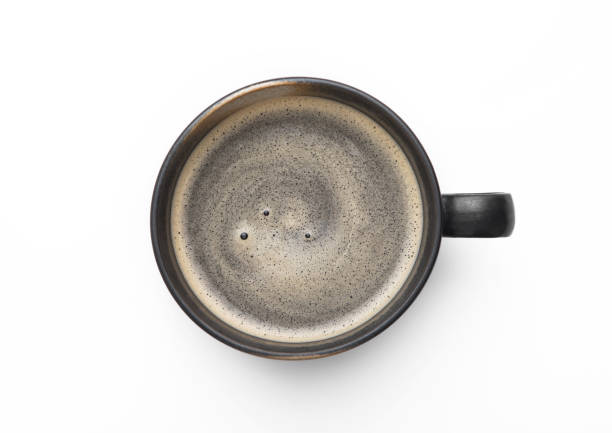 istock Large black coffee in porcelain cup on white background. Top view. 1450277108