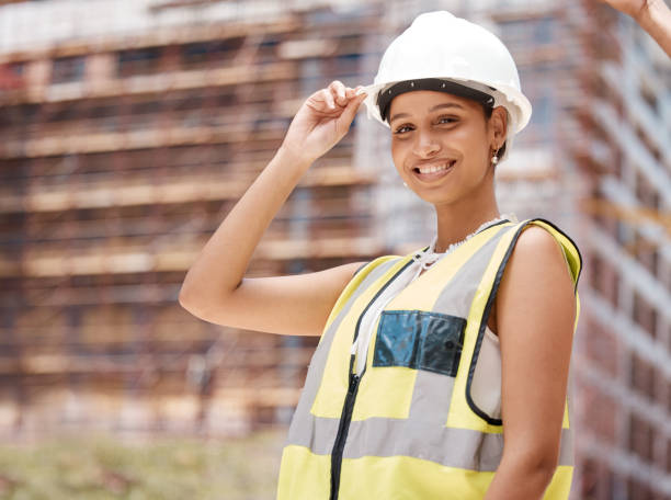 istock Building, construction site and architect portrait of woman in engineering. Engineer, architecture and construction worker in safety gear to check building site. Black woman contractor happy at work 1450278410