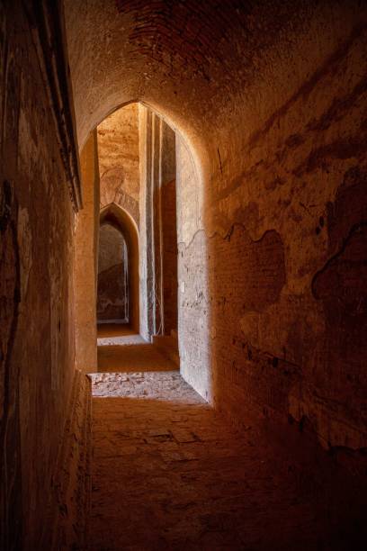 istock Dramatic Lighting Inside One of the Thousands of Buddhist Temples in Bagan, Myanmar. 1450279712