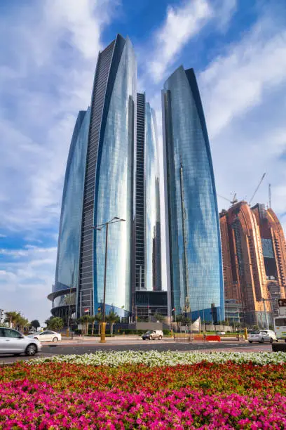 Photo of Abu Dhabi, UAE - March 28, 2014: Etihad Towers buildings in Abu Dhabi. United Arab Emirates. Five towers complex with 74 floors is the third tallest building in Abu Dhabi.