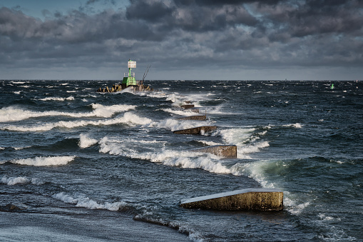 Windy day at wintery beach by the Baltic Sea in Gdansk. Poland