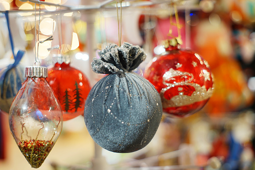 Christmas balls on artificial Christmas tree close up.