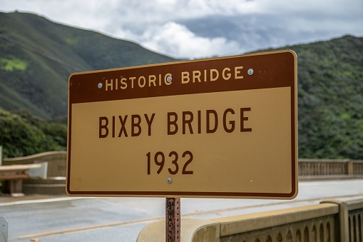 A sign for the historic Bixby Creek Bridge on the Pacific Coast Highway in California, United States.