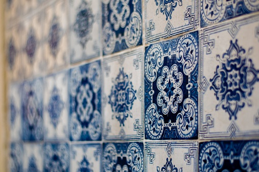 A selective shot of an entirely decorated wall with Azulejo tiles in Lisbon, Portugal