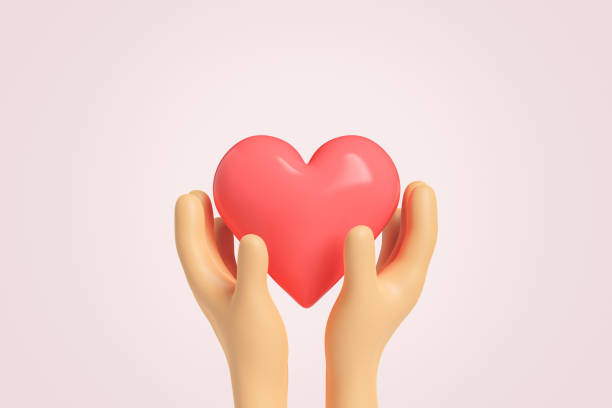 hands holding a big red heart stock photo