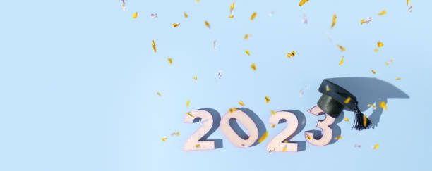 istock Class of 2023 concept. Numbers 2023 with black graduated cap on colored background 1450286313