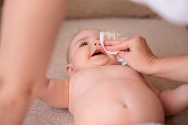 istock Mother wiping baby after bathing 1450286508